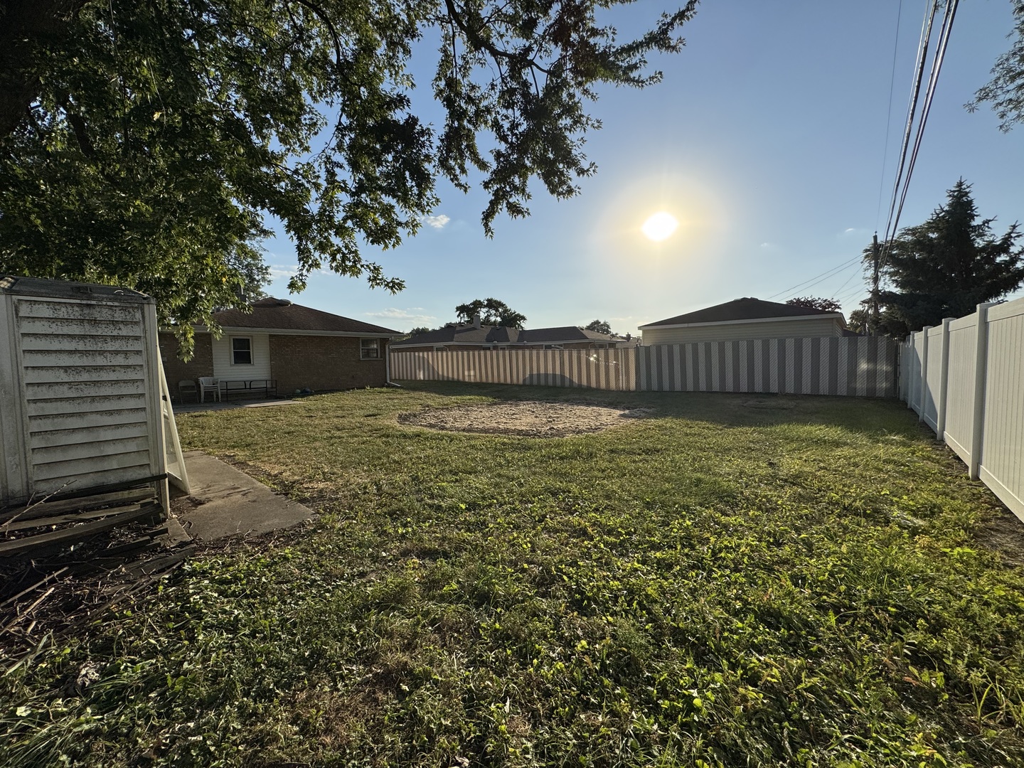 7838 West 73rd Place Bridgeview, IL 60455 - Photo 20 of 22 a view of a yard with a large tree and a yard