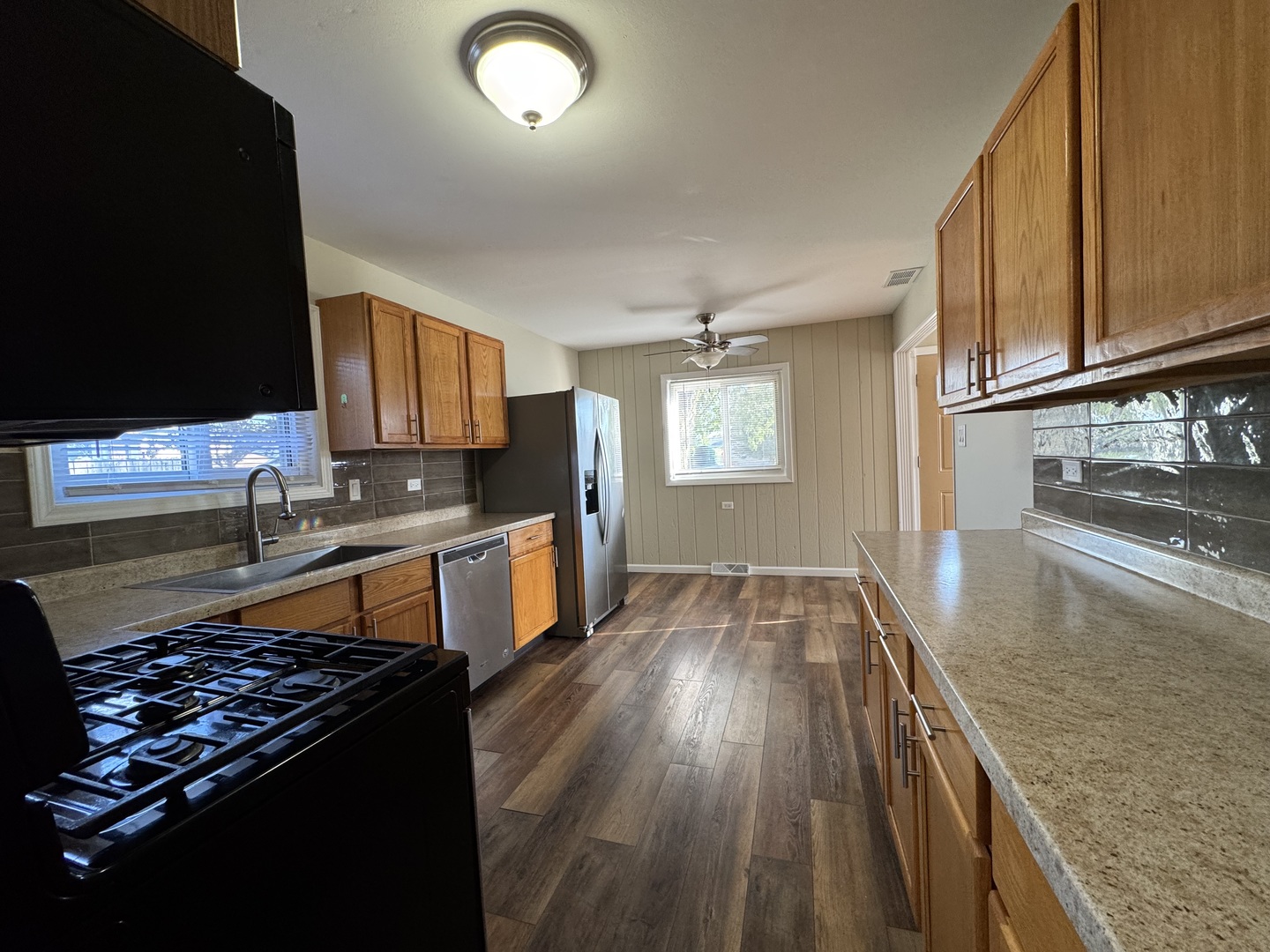 7838 West 73rd Place Bridgeview, IL 60455 - Photo 2 of 22 a kitchen with wooden floors and a appliances
