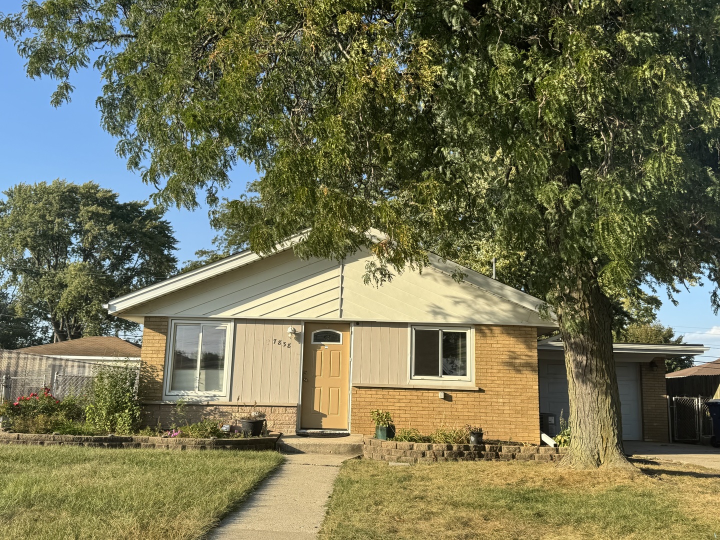 7838 West 73rd Place Bridgeview, IL 60455 - Photo 22 of 22 a front view of a house with garden