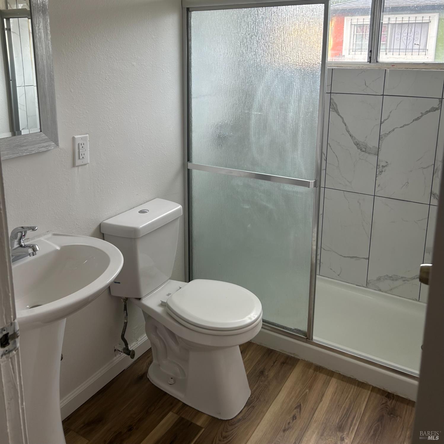 243 Sage Street Vallejo, CA 94589 - Photo 4 of 9 a bathroom with a sink toilet and shower