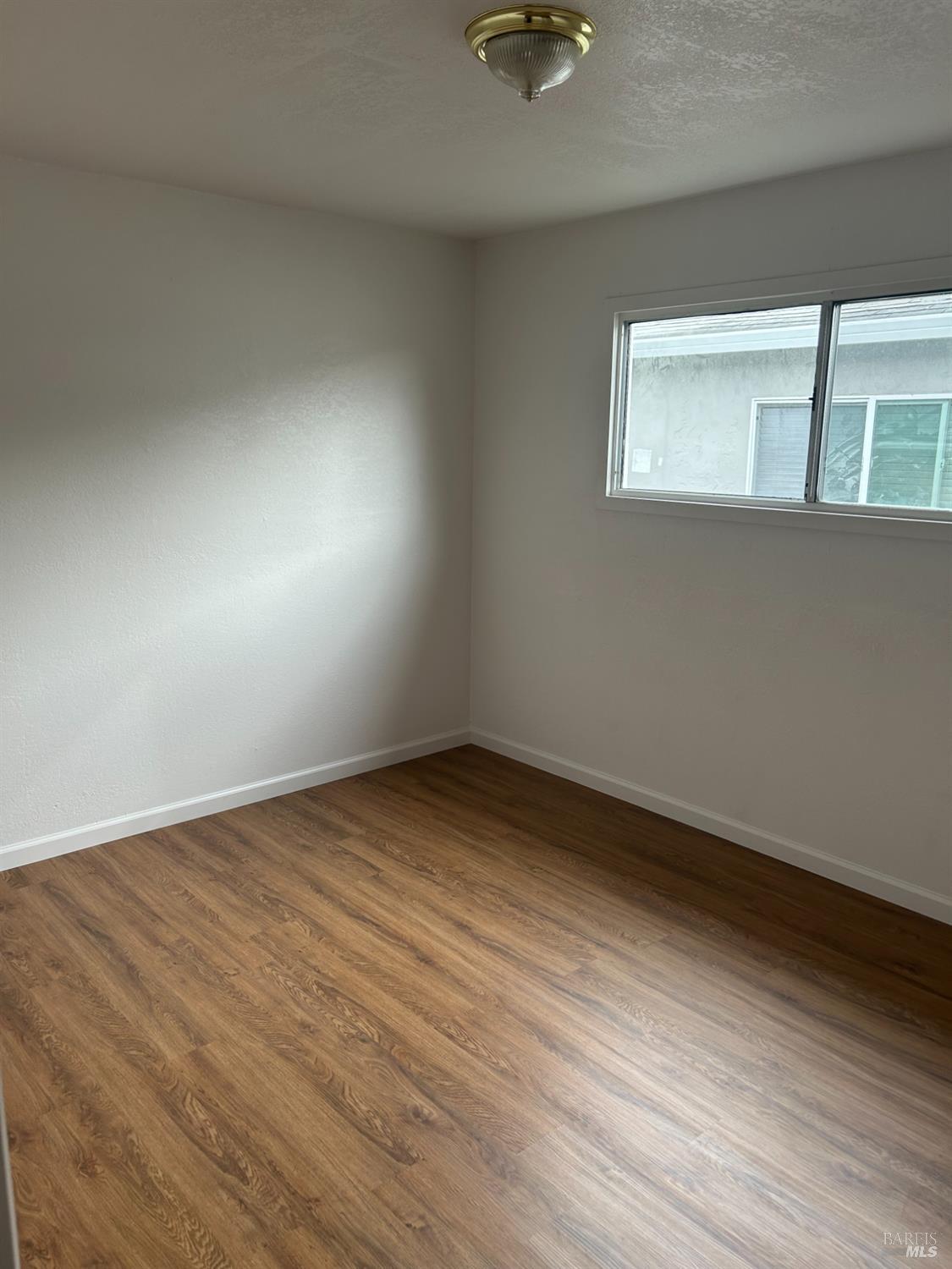 243 Sage Street Vallejo, CA 94589 - Photo 5 of 9 a view of an empty room with windows