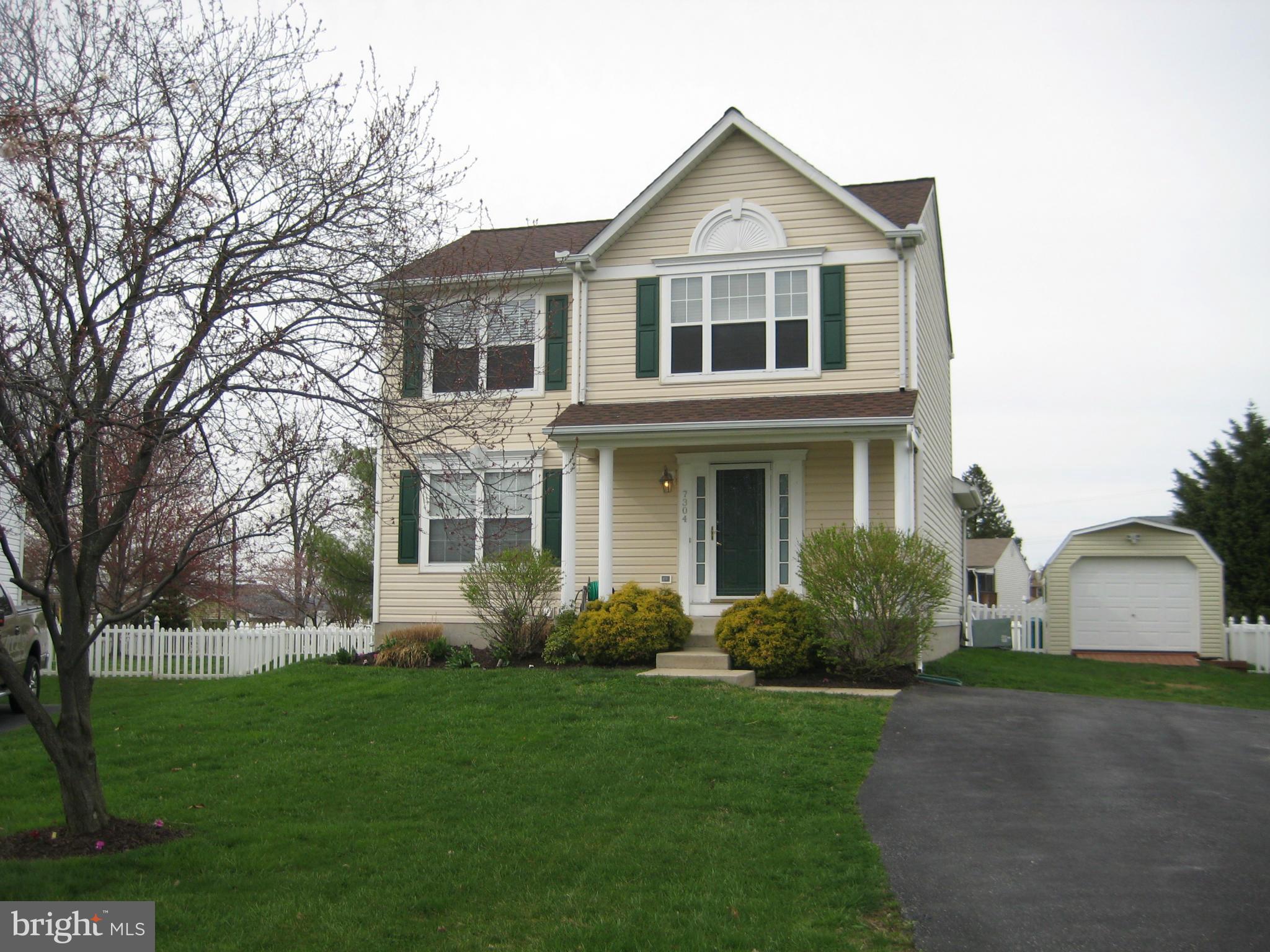 7304 Gunpowder Road Baltimore, MD 21220 - Photo 2 of 30 a front view of a house with a garden and plants