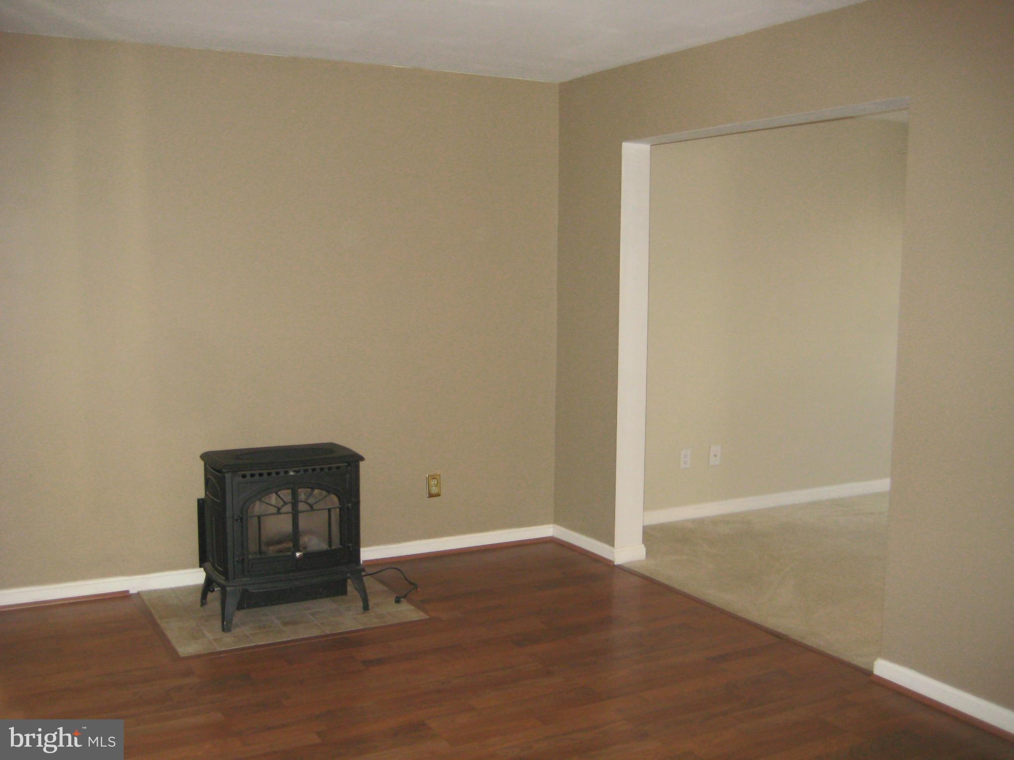 7304 Gunpowder Road Baltimore, MD 21220 - Photo 12 of 30 an empty room with wooden floor and closet