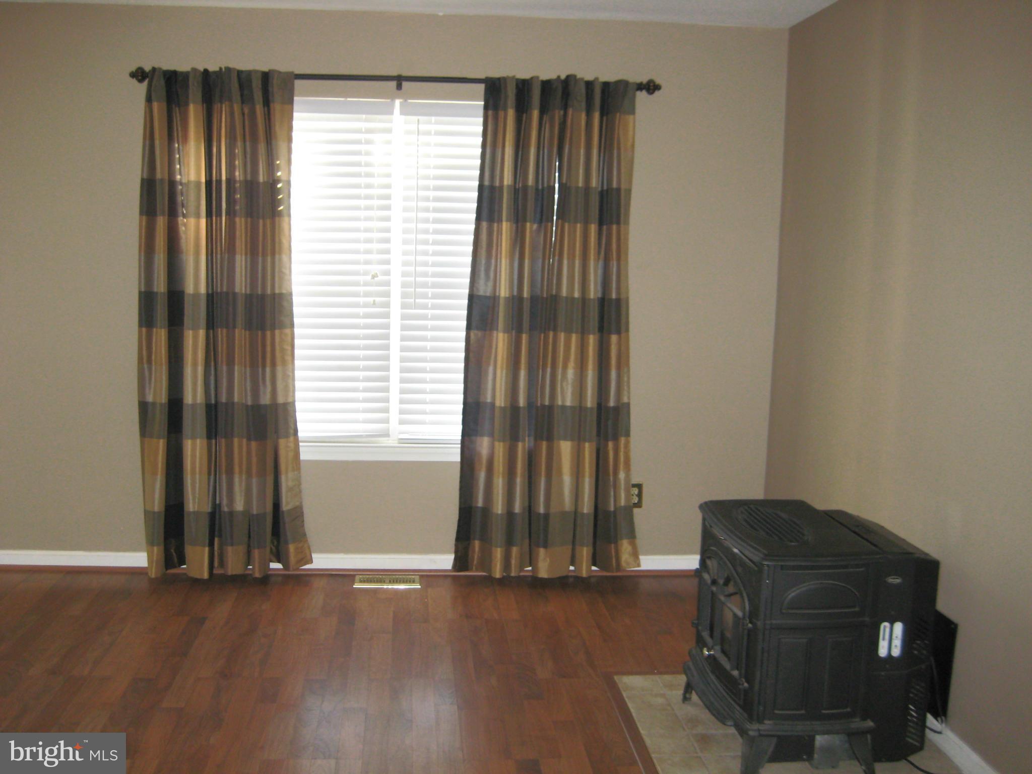 7304 Gunpowder Road Baltimore, MD 21220 - Photo 13 of 30 a living room with furniture and a window