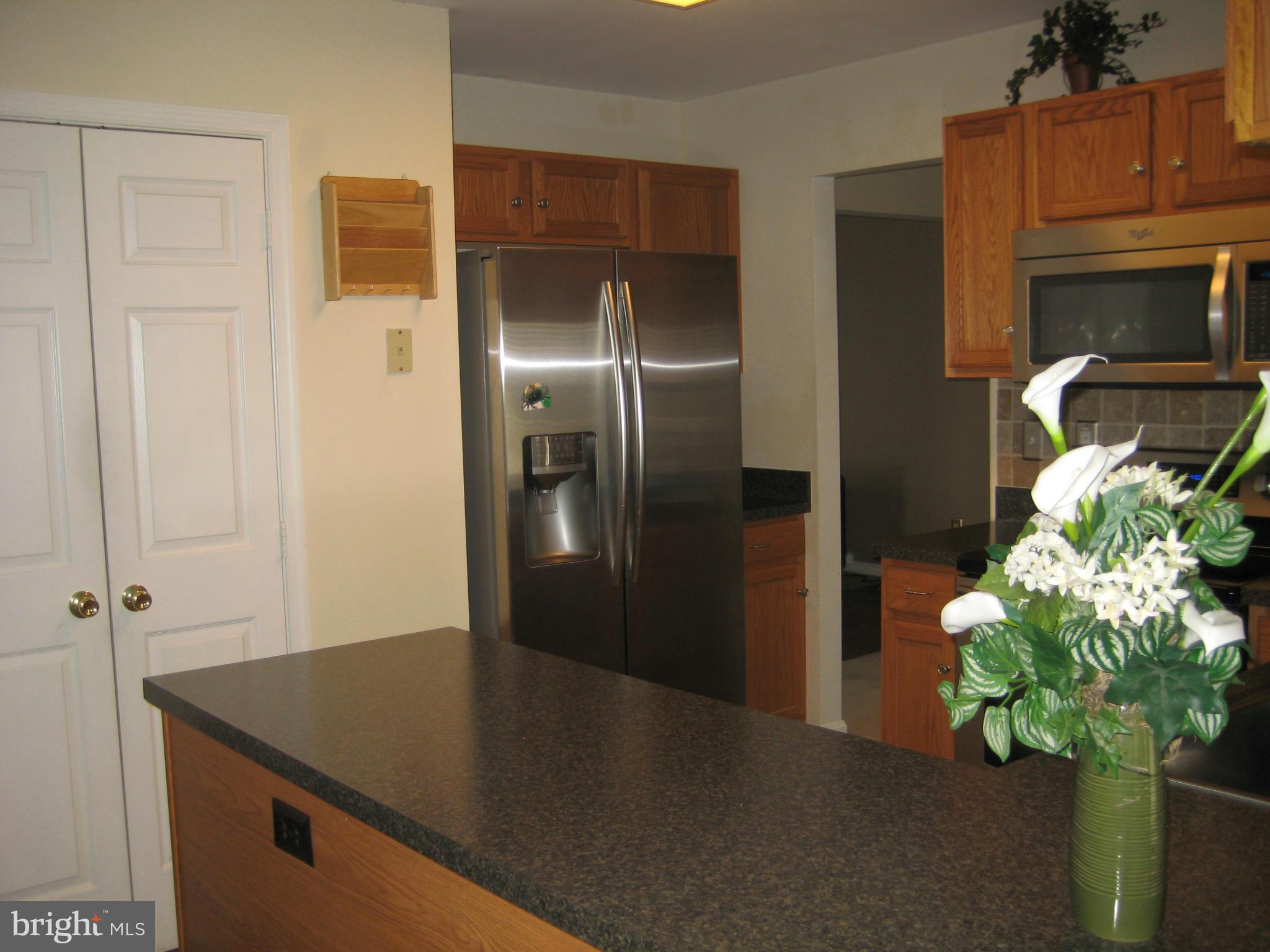 7304 Gunpowder Road Baltimore, MD 21220 - Photo 17 of 30 a view of kitchen with stainless steel appliances granite countertop refrigerator a sink