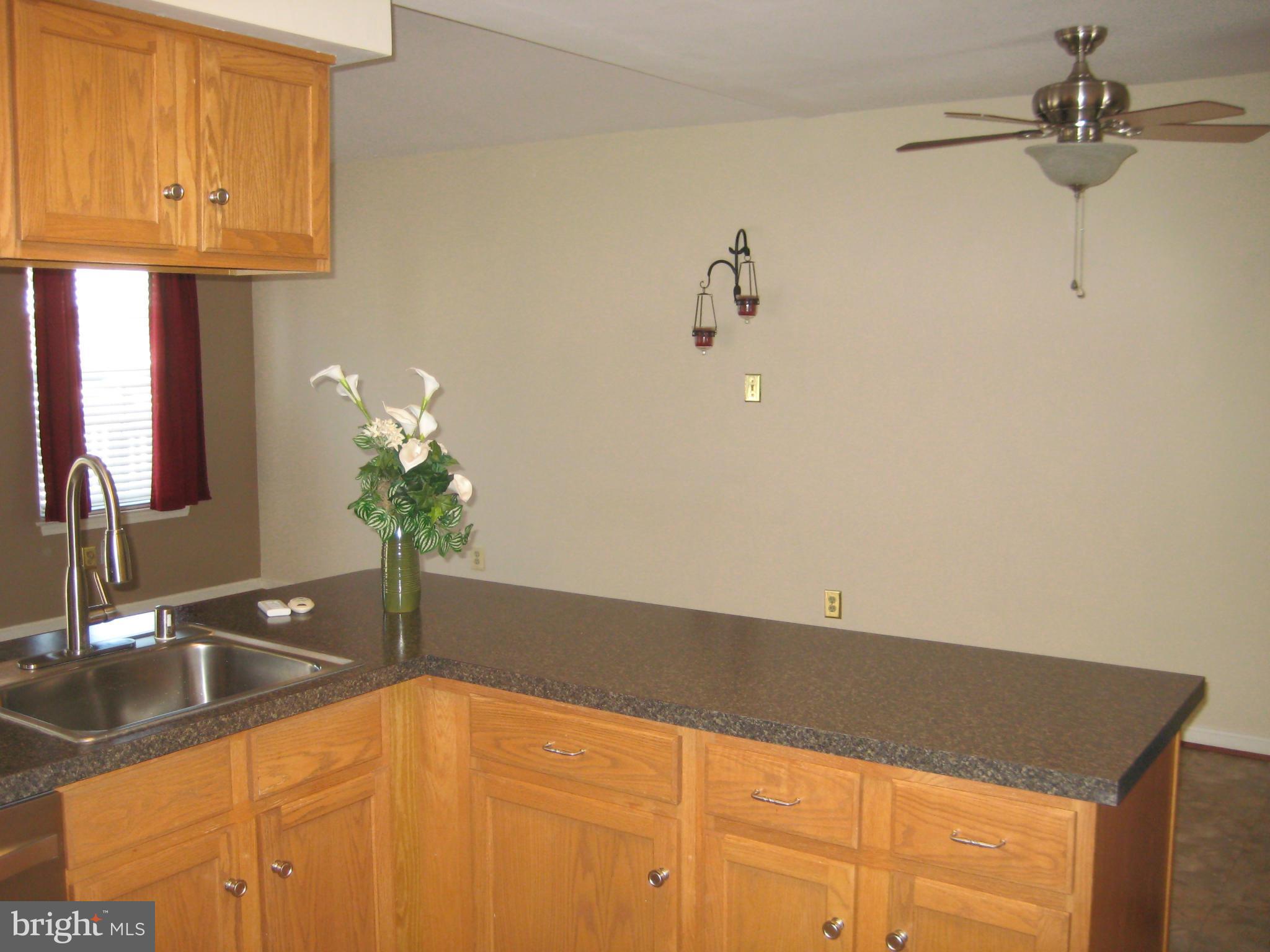 7304 Gunpowder Road Baltimore, MD 21220 - Photo 18 of 30 a bathroom with a granite countertop sink and a mirror