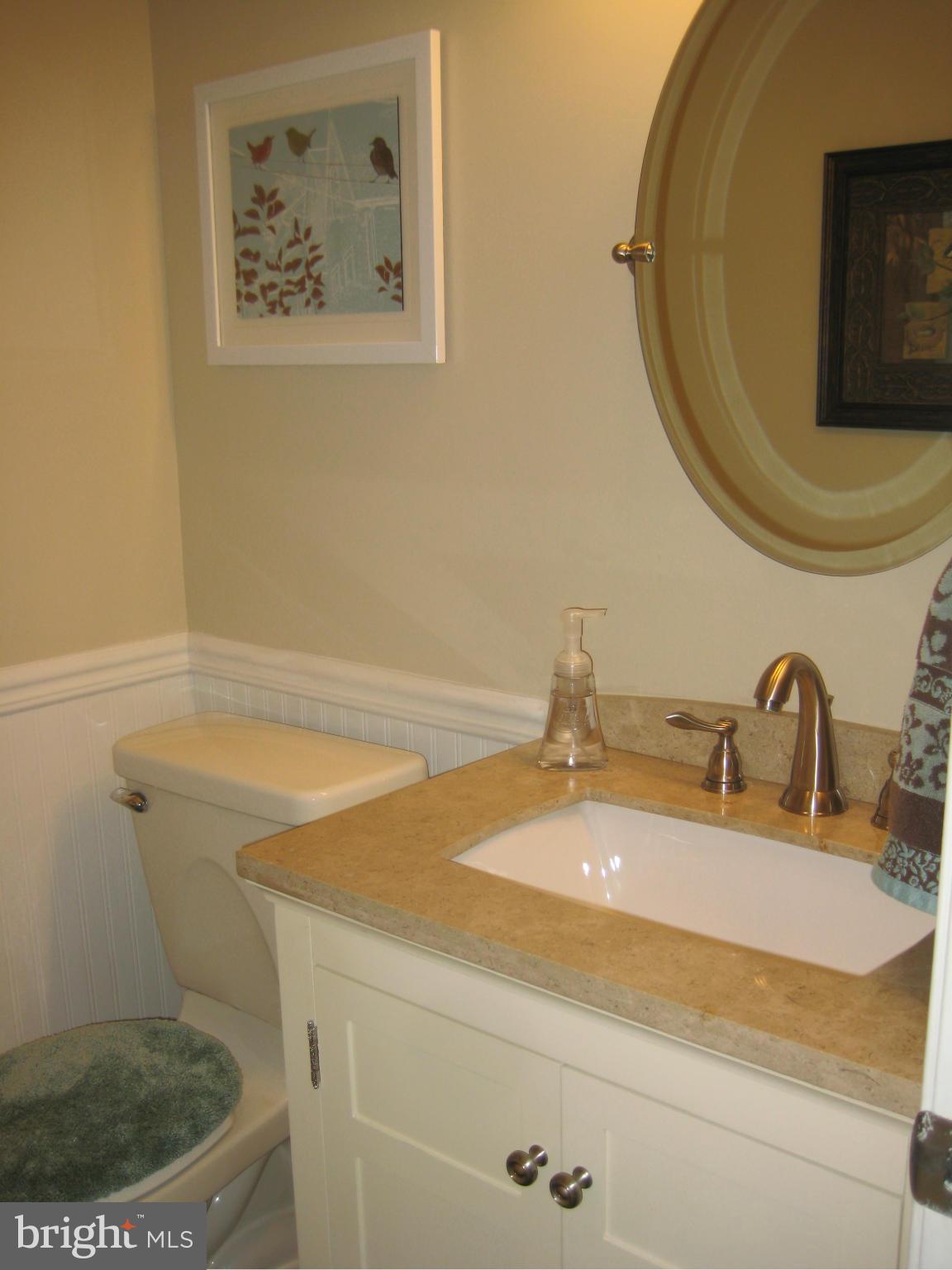 7304 Gunpowder Road Baltimore, MD 21220 - Photo 21 of 30 a bathroom with a sink and a mirror