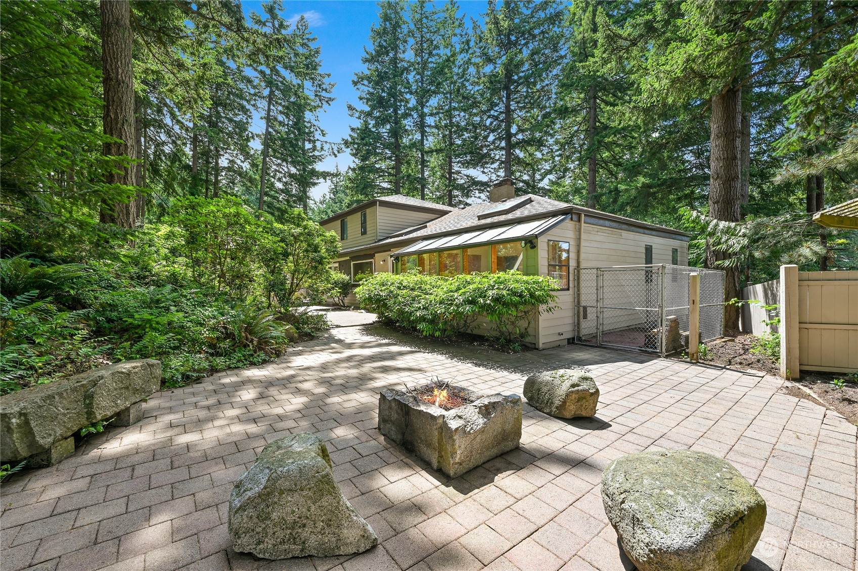 a view of backyard with patio