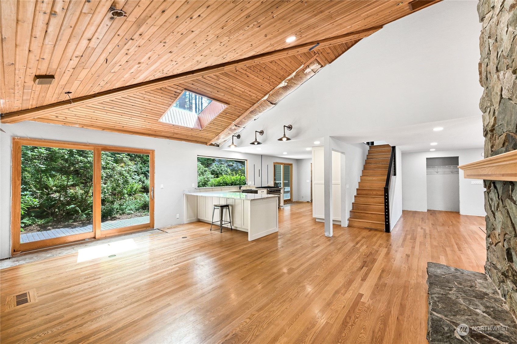 615 Canyon View Road Bellingham, WA 98225 - Photo 14 of 39 a view of a patio with table and chairs a barbeque with wooden floor and roof