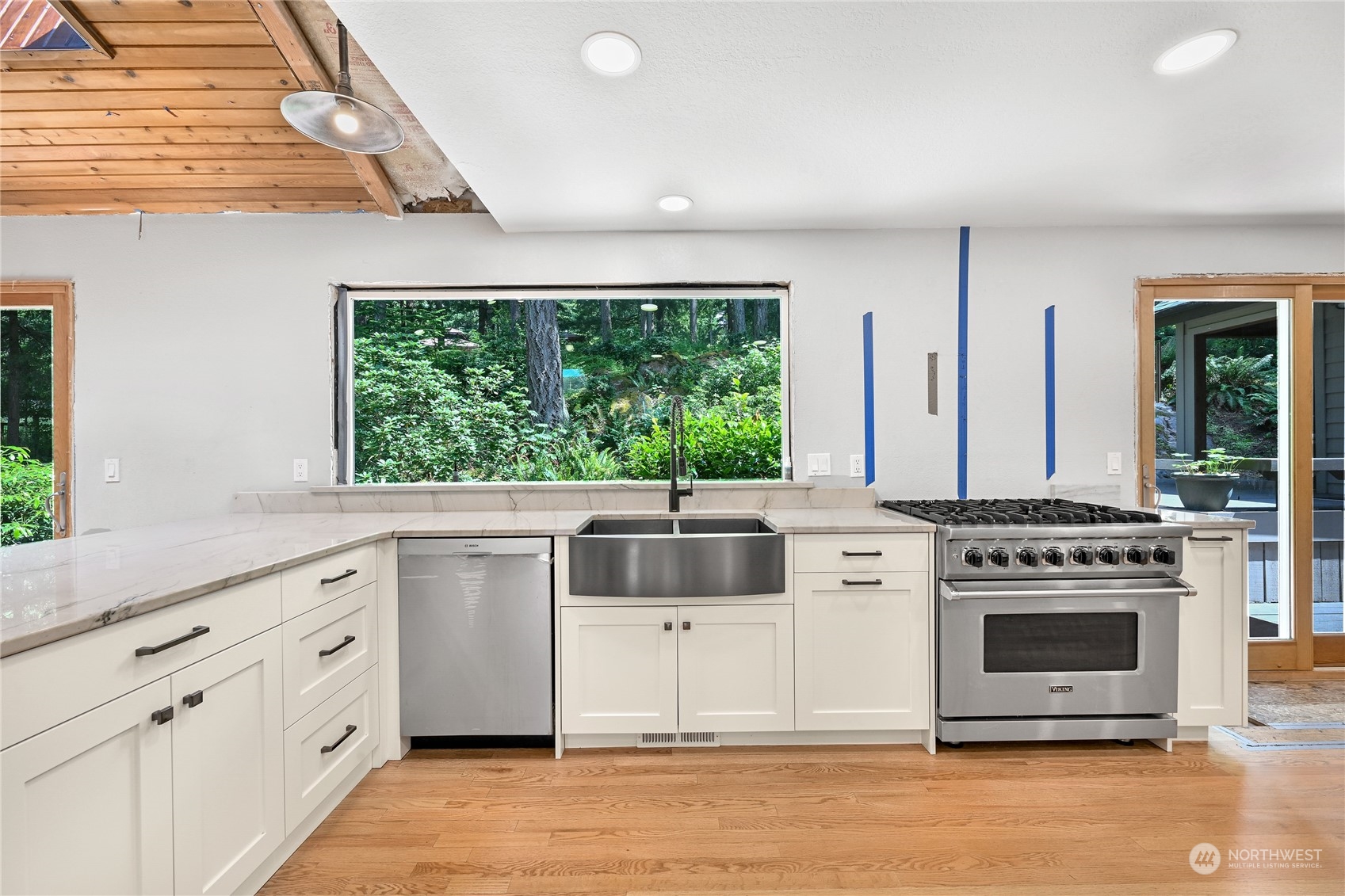 615 Canyon View Road Bellingham, WA 98225 - Photo 16 of 39 a kitchen with stainless steel appliances a stove sink and cabinets