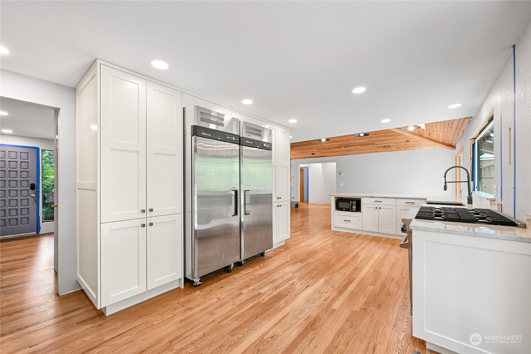 615 Canyon View Road Bellingham, WA 98225 - Photo 18 of 39 a view of a kitchen with a sink and wooden floor