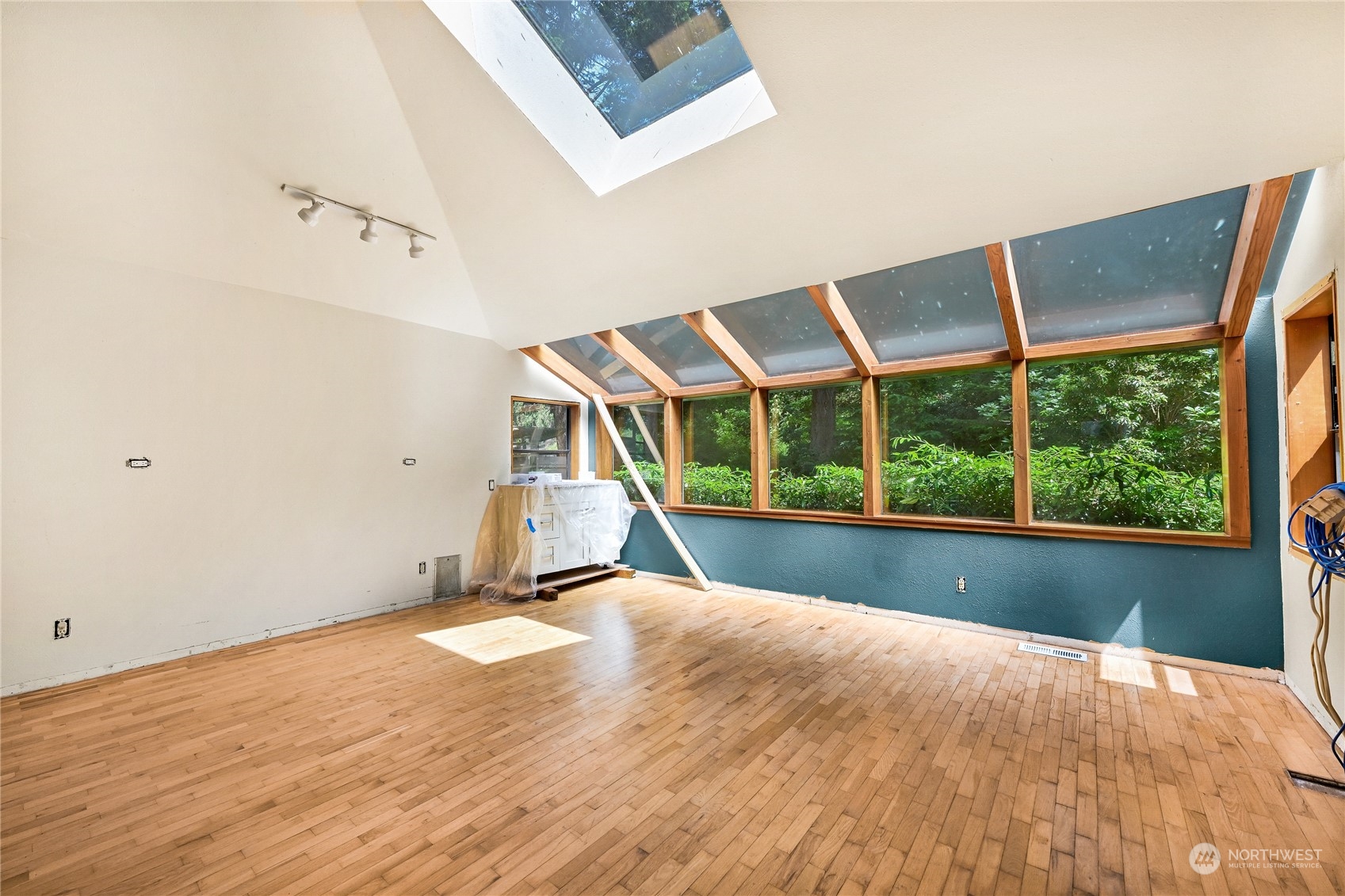 615 Canyon View Road Bellingham, WA 98225 - Photo 20 of 39 a view of an empty room with wooden floor and windows