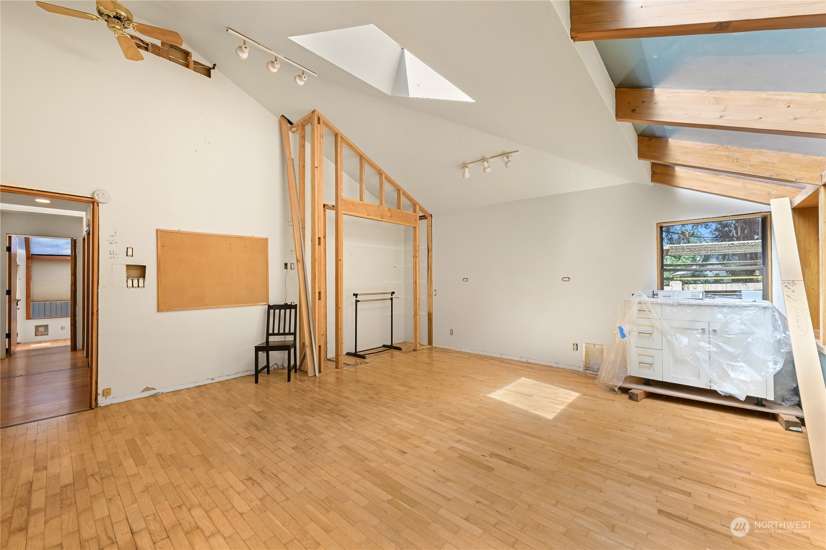 615 Canyon View Road Bellingham, WA 98225 - Photo 21 of 39 a view of a livingroom with wooden floor and a ceiling fan