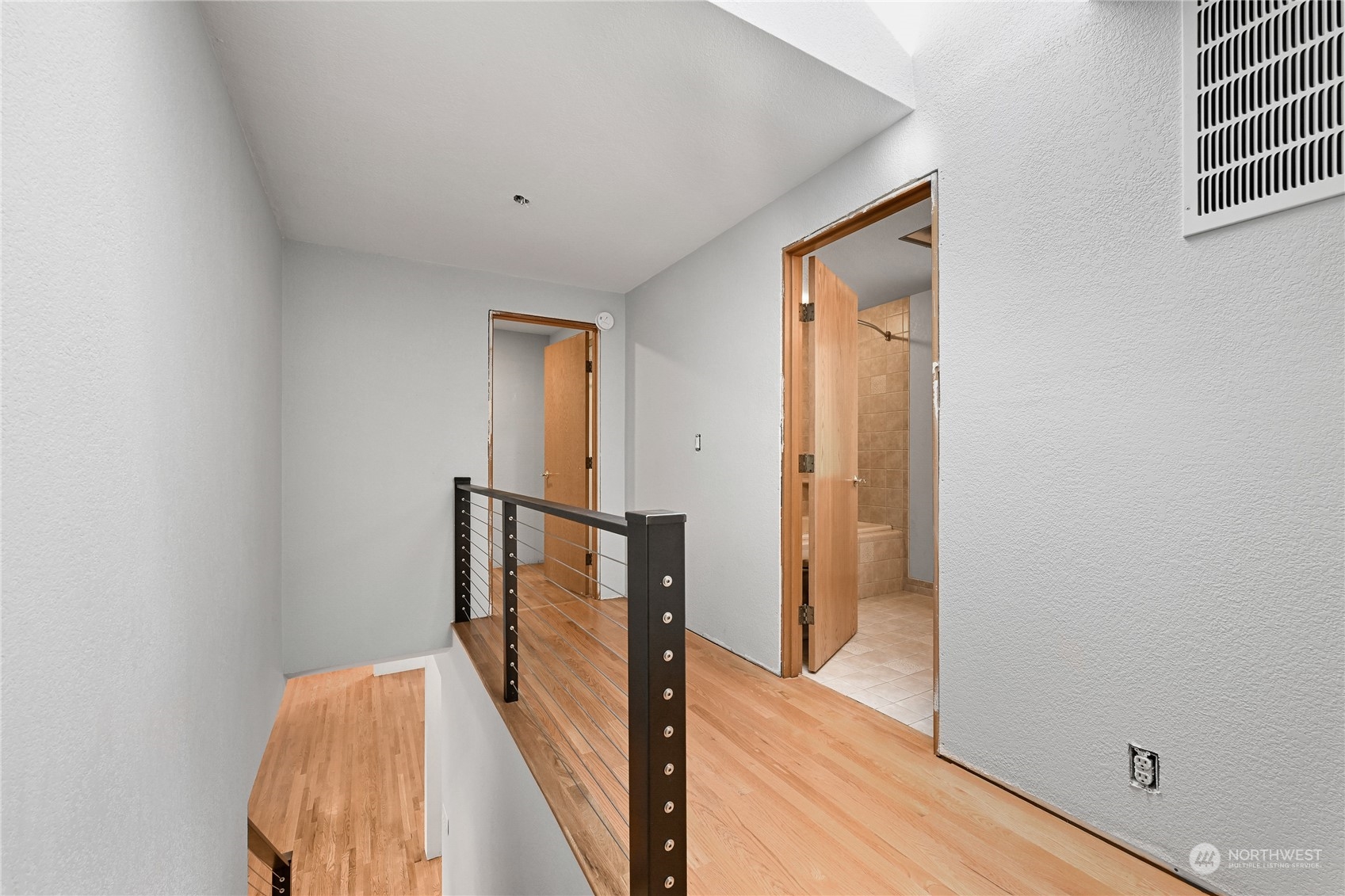 615 Canyon View Road Bellingham, WA 98225 - Photo 26 of 39 a view of a hallway with wooden floor and staircase