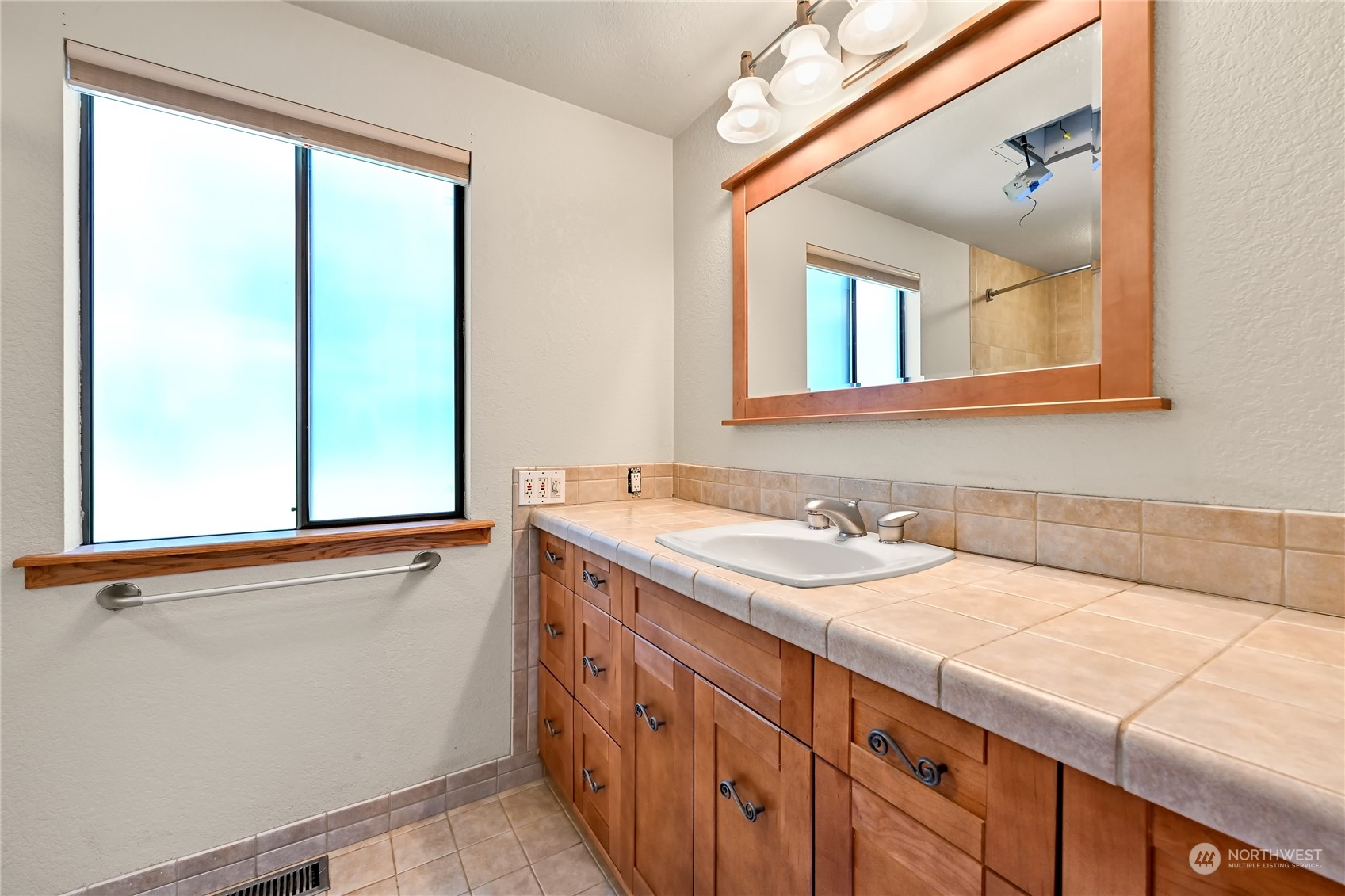 615 Canyon View Road Bellingham, WA 98225 - Photo 30 of 39 a bathroom with a sink and a mirror