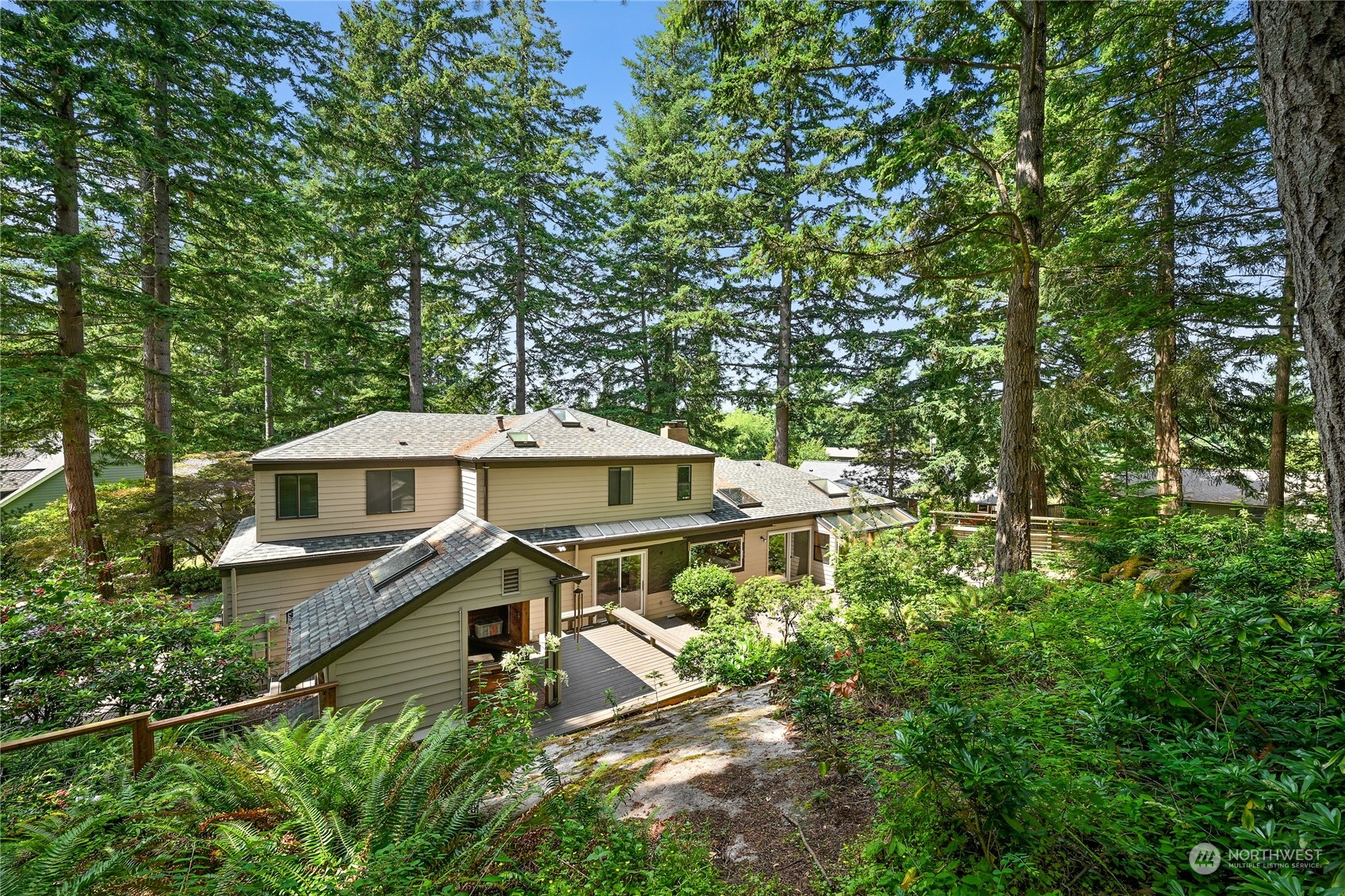 615 Canyon View Road Bellingham, WA 98225 - Photo 3 of 39 a house with trees in front of it