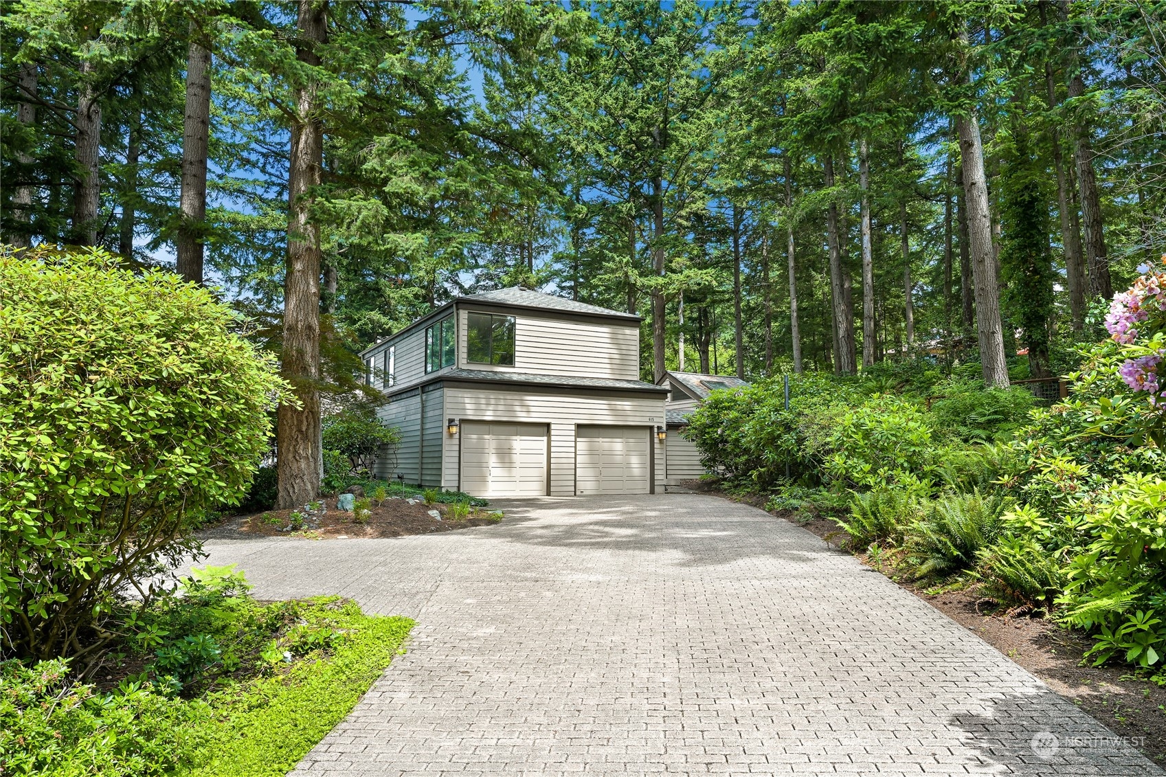 615 Canyon View Road Bellingham, WA 98225 - Photo 4 of 39 a front view of a house with a yard and trees