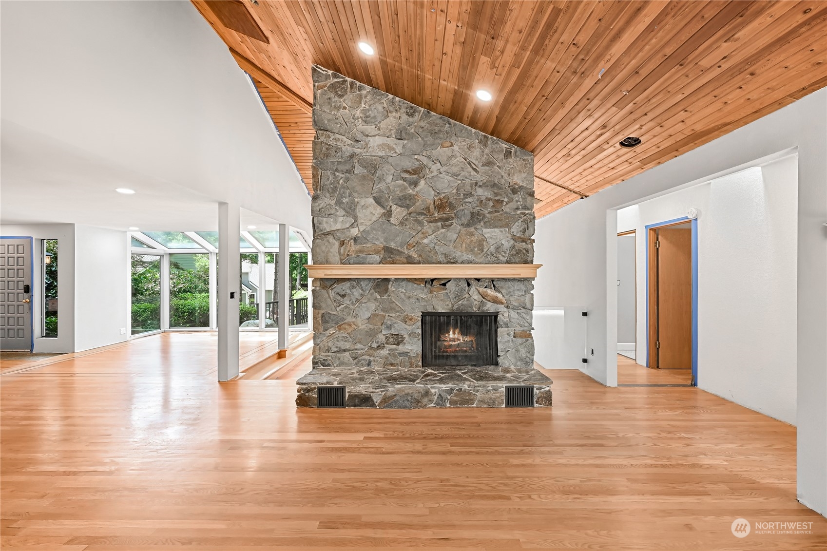 615 Canyon View Road Bellingham, WA 98225 - Photo 9 of 39 a view of empty room with wooden floor and fireplace