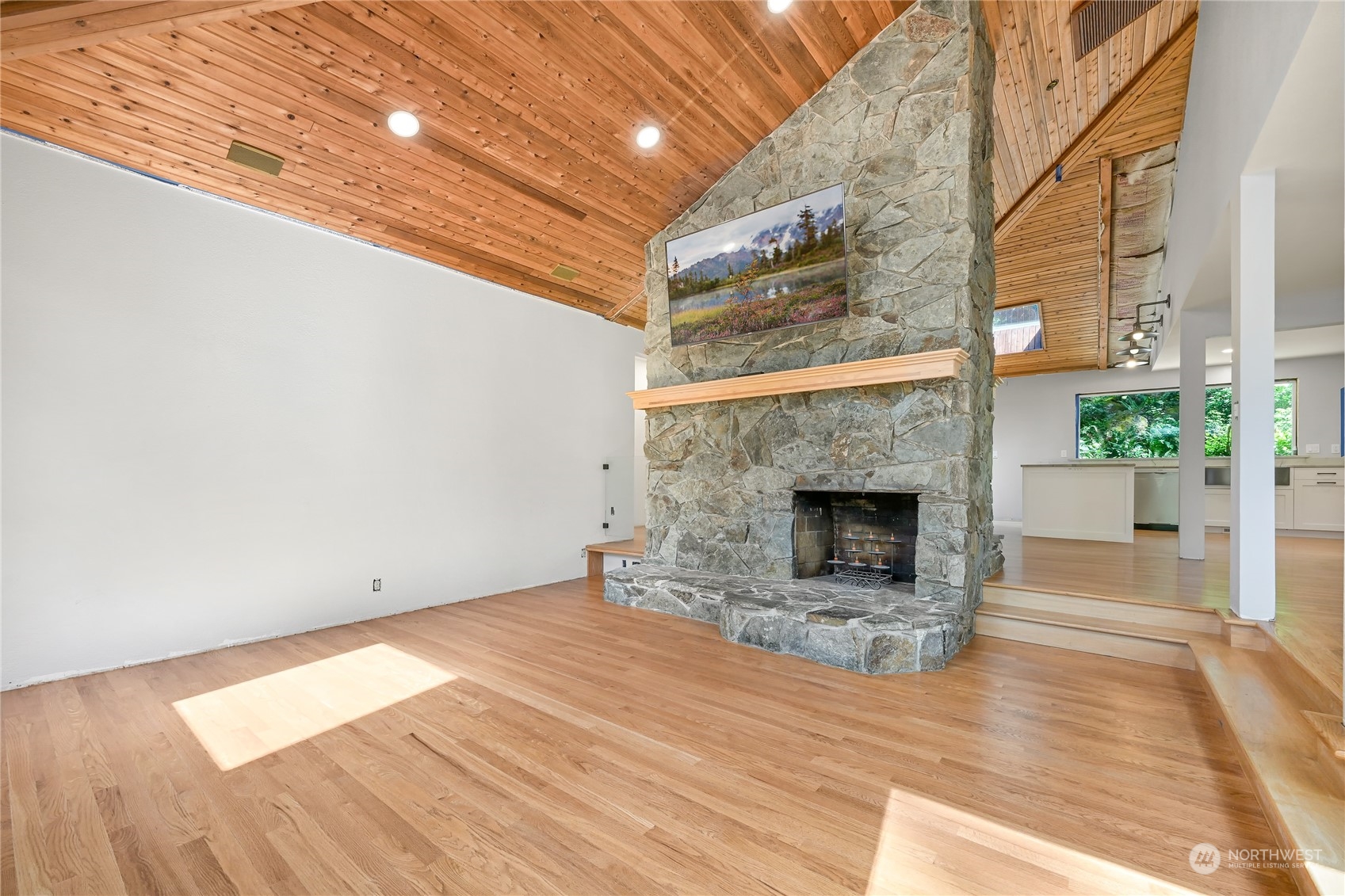 615 Canyon View Road Bellingham, WA 98225 - Photo 10 of 39 a view of empty room with wooden floor and fireplace