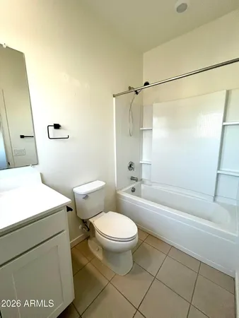 a bathroom with a toilet a sink and a shower
