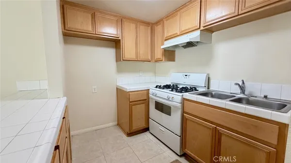 a view of a kitchen with sink dryer and washer