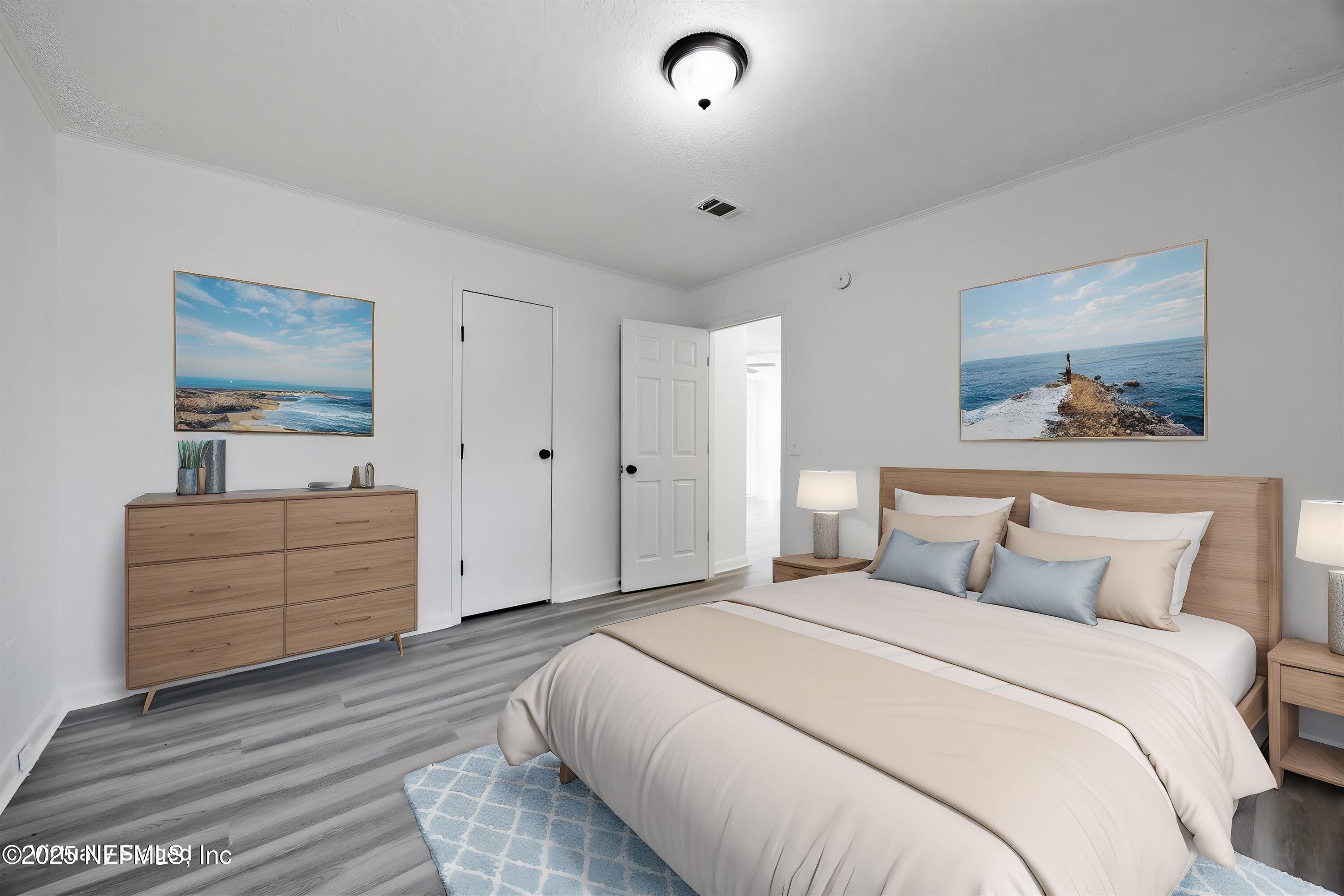 900 Helen Street St. Augustine, FL 32084 - Photo 16 of 30 a bedroom with a bed and a dresser