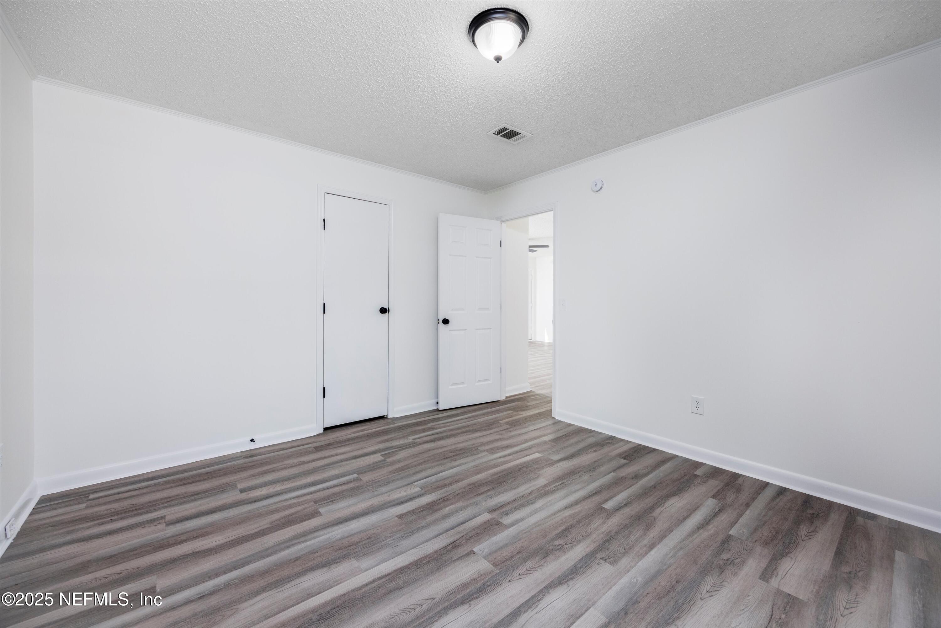 900 Helen Street St. Augustine, FL 32084 - Photo 17 of 30 a view of room with wooden floor