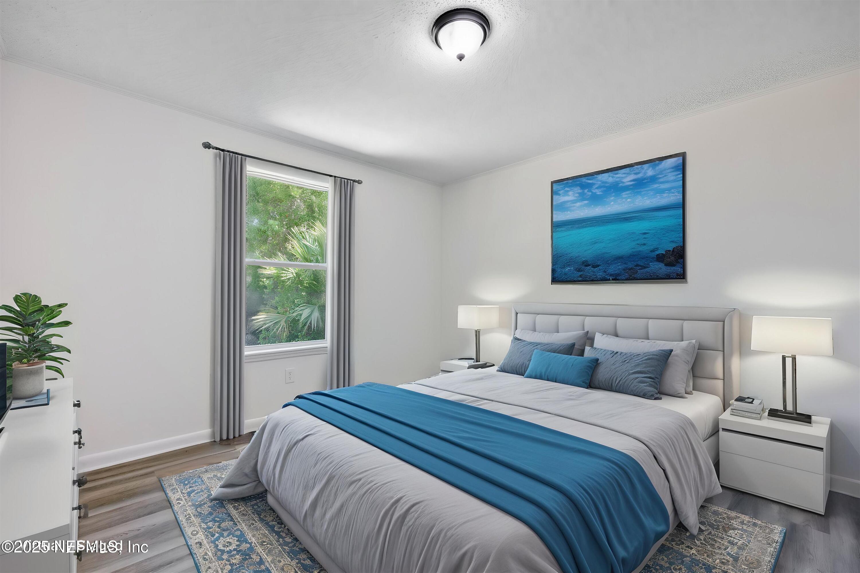 900 Helen Street St. Augustine, FL 32084 - Photo 20 of 30 a bedroom with a large bed and a window