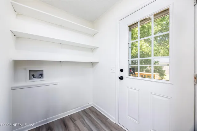 a view of a room that has a window in it