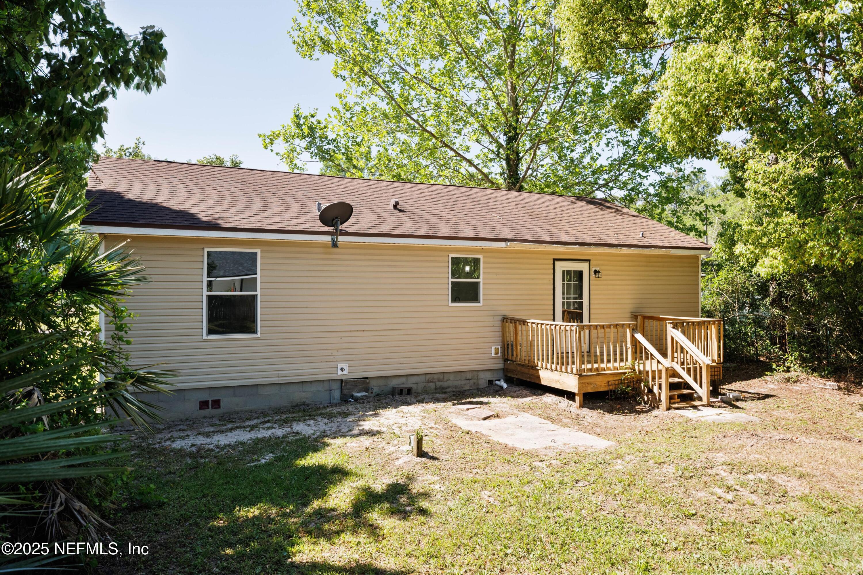 900 Helen Street St. Augustine, FL 32084 - Photo 29 of 30 a view of a house with a yard covered in snow