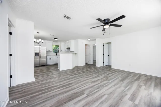 a view of a kitchen with a sink and cabinet