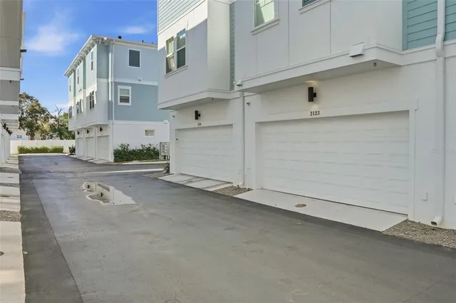 a view of a utility room with cabinets