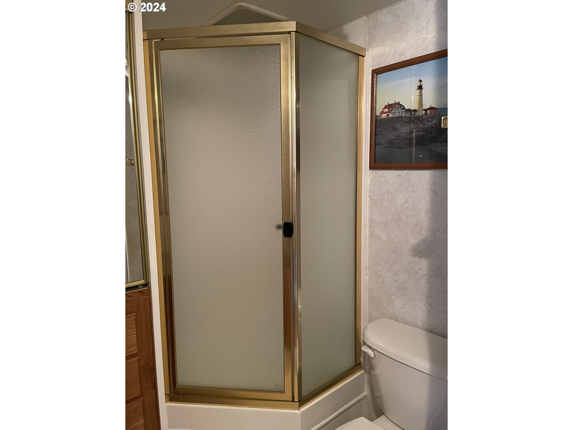 206 Bourbon Street Florence, OR 97439 - Photo 20 of 28 a view of a bathroom with a glass door