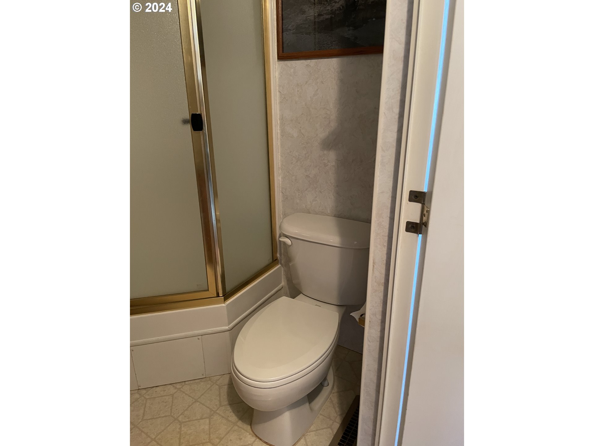 206 Bourbon Street Florence, OR 97439 - Photo 21 of 28 a white toilet sitting next to a shower