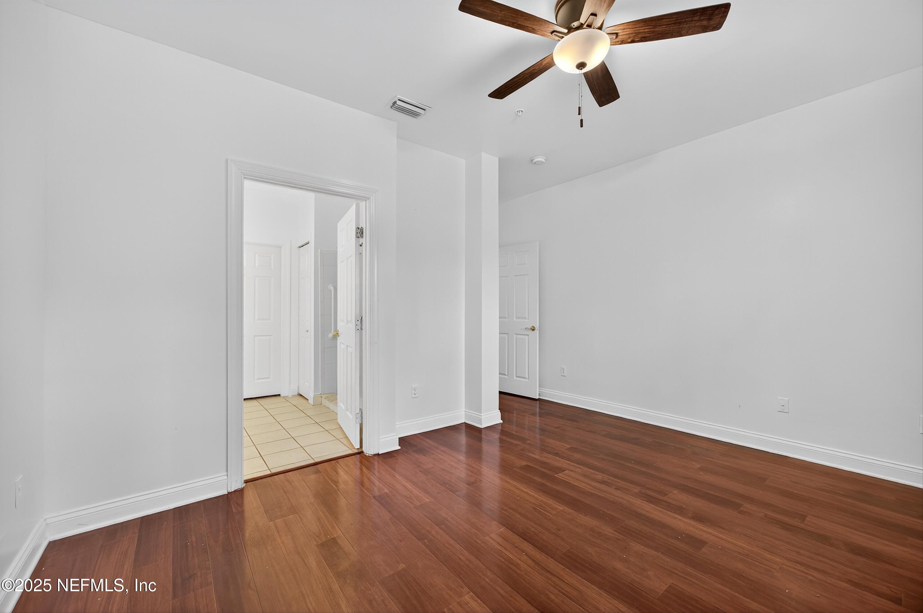 210 Presidents Cup Way, Unit 101 St. Augustine, FL 32092 - Photo 21 of 37 wooden floor in an empty room