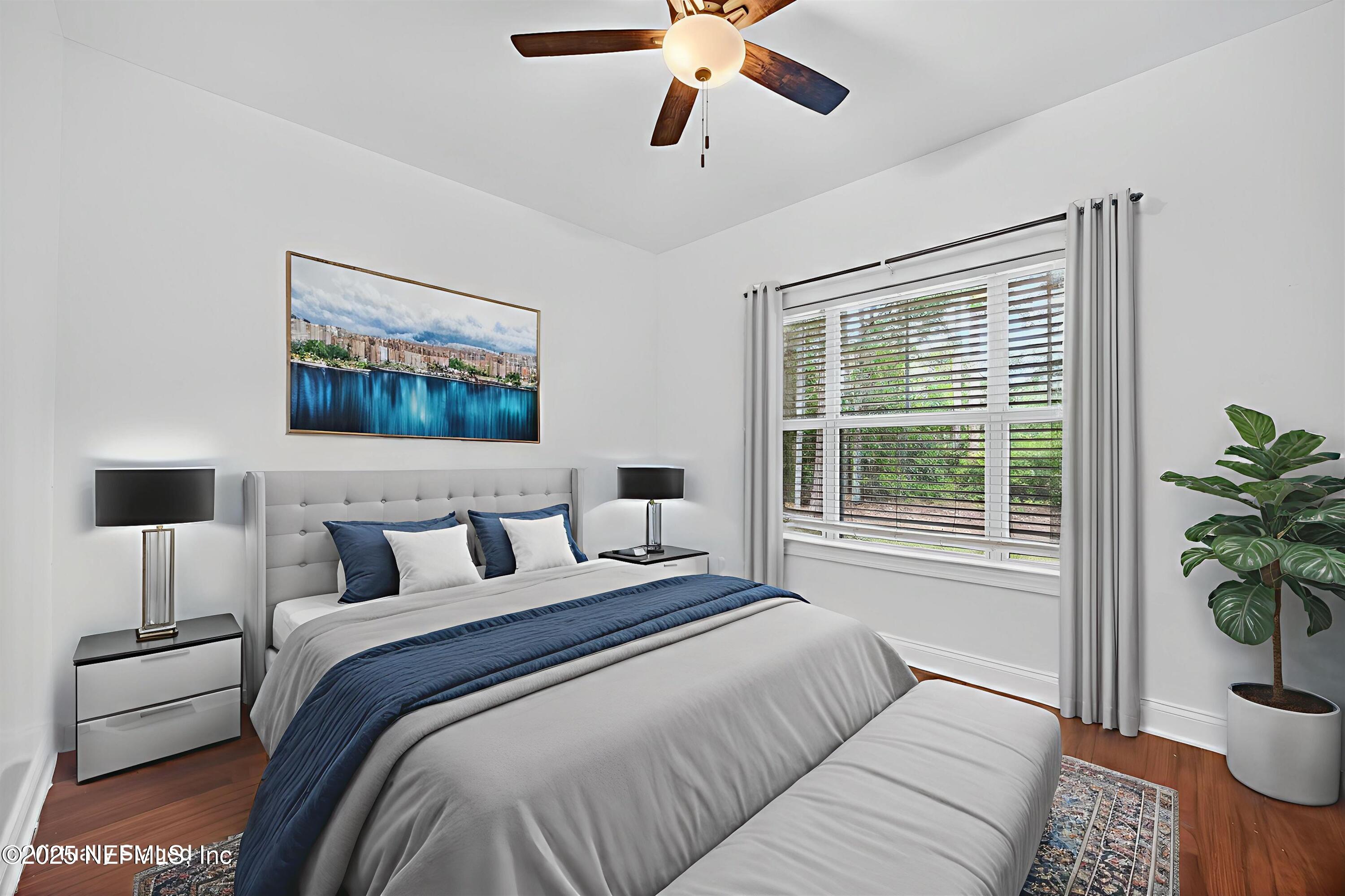 210 Presidents Cup Way, Unit 101 St. Augustine, FL 32092 - Photo 29 of 37 a bedroom with a bed and a potted plant