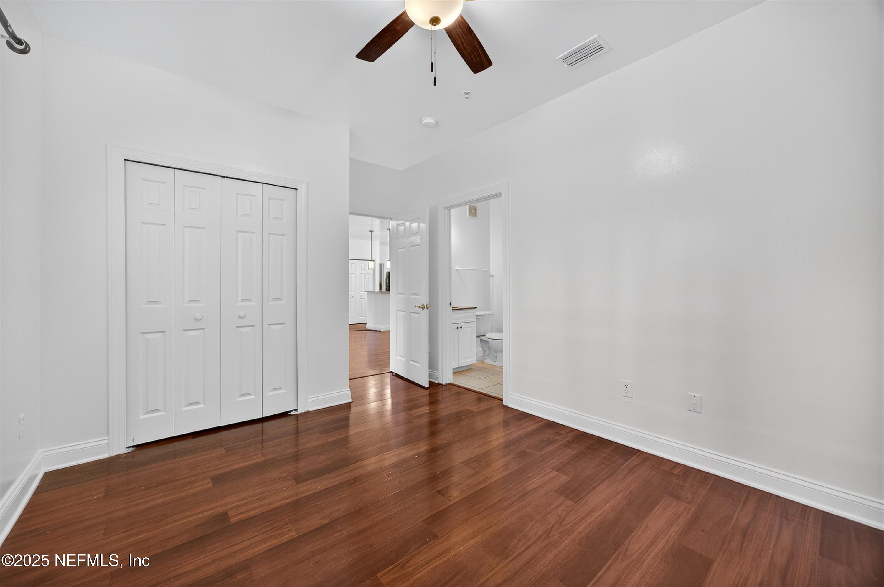 210 Presidents Cup Way, Unit 101 St. Augustine, FL 32092 - Photo 31 of 37 wooden floor in an empty room