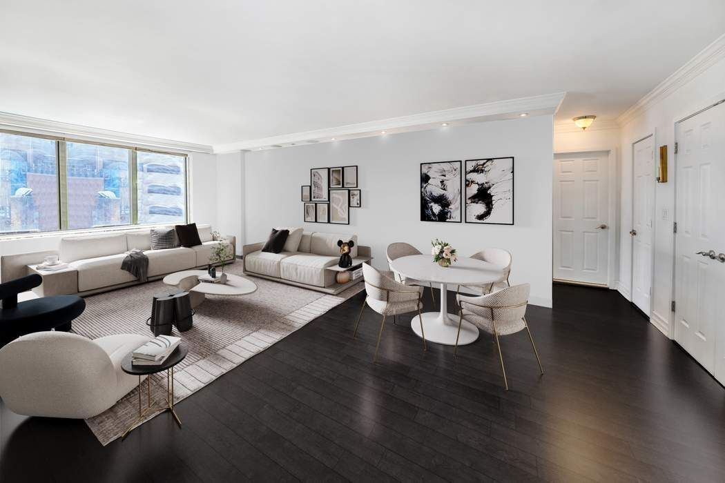 207 East 74th Street, Unit 7F Manhattan, NY 10021 - Photo 9 of 10 a living room with furniture and wooden floor
