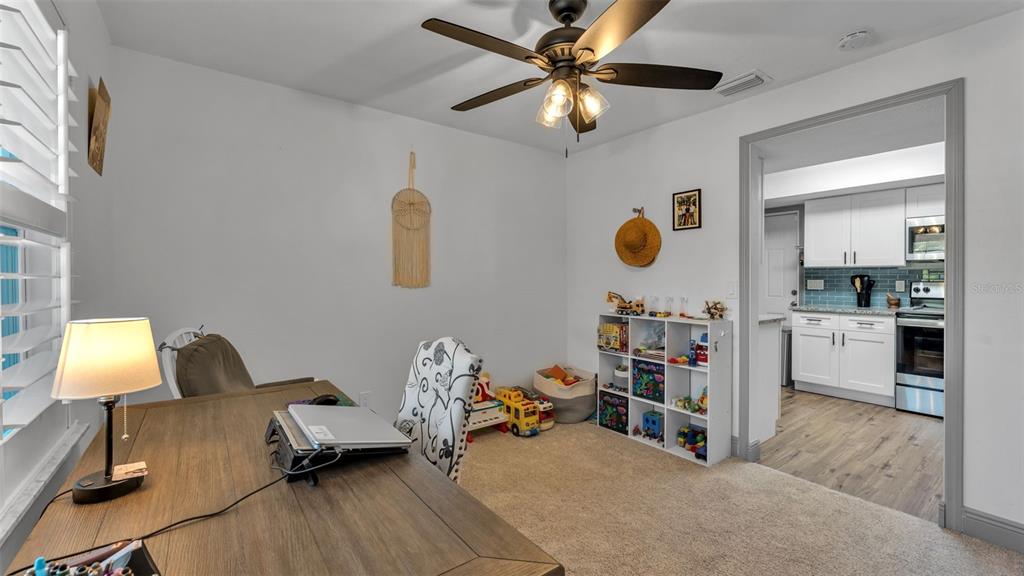 1005 Swilley Road Plant City, FL 33567 - Photo 12 of 24 a living room with furniture and a flat screen tv