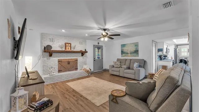 a living room with furniture and a fireplace