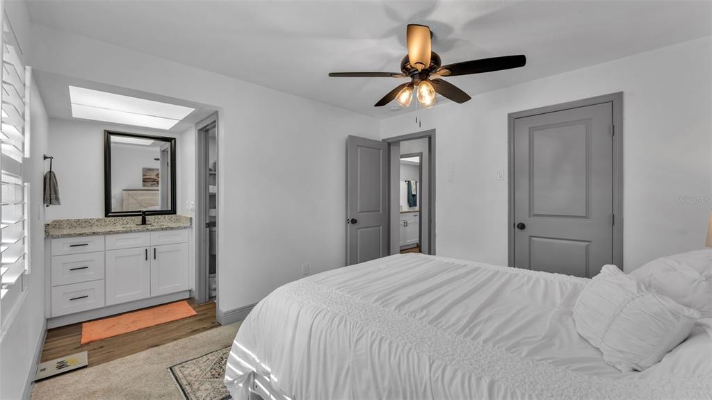 1005 Swilley Road Plant City, FL 33567 - Photo 5 of 24 a bedroom with a bed and a chandelier