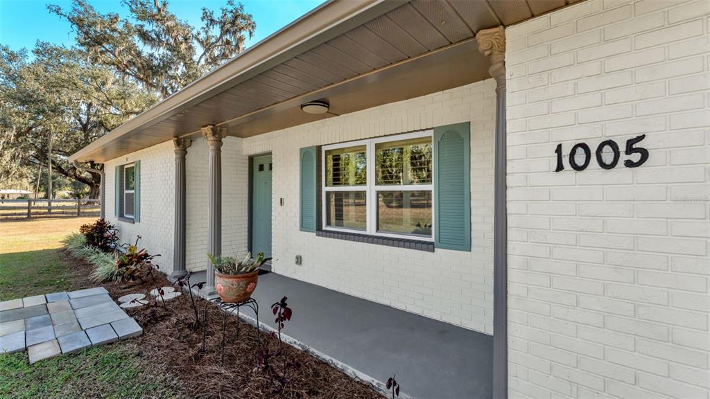 1005 Swilley Road Plant City, FL 33567 - Photo 6 of 24 a front view of a house with a yard