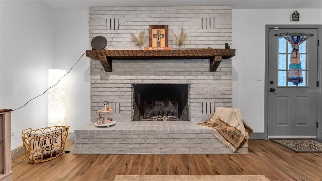 1005 Swilley Road Plant City, FL 33567 - Photo 8 of 24 a living room with furniture and a fireplace