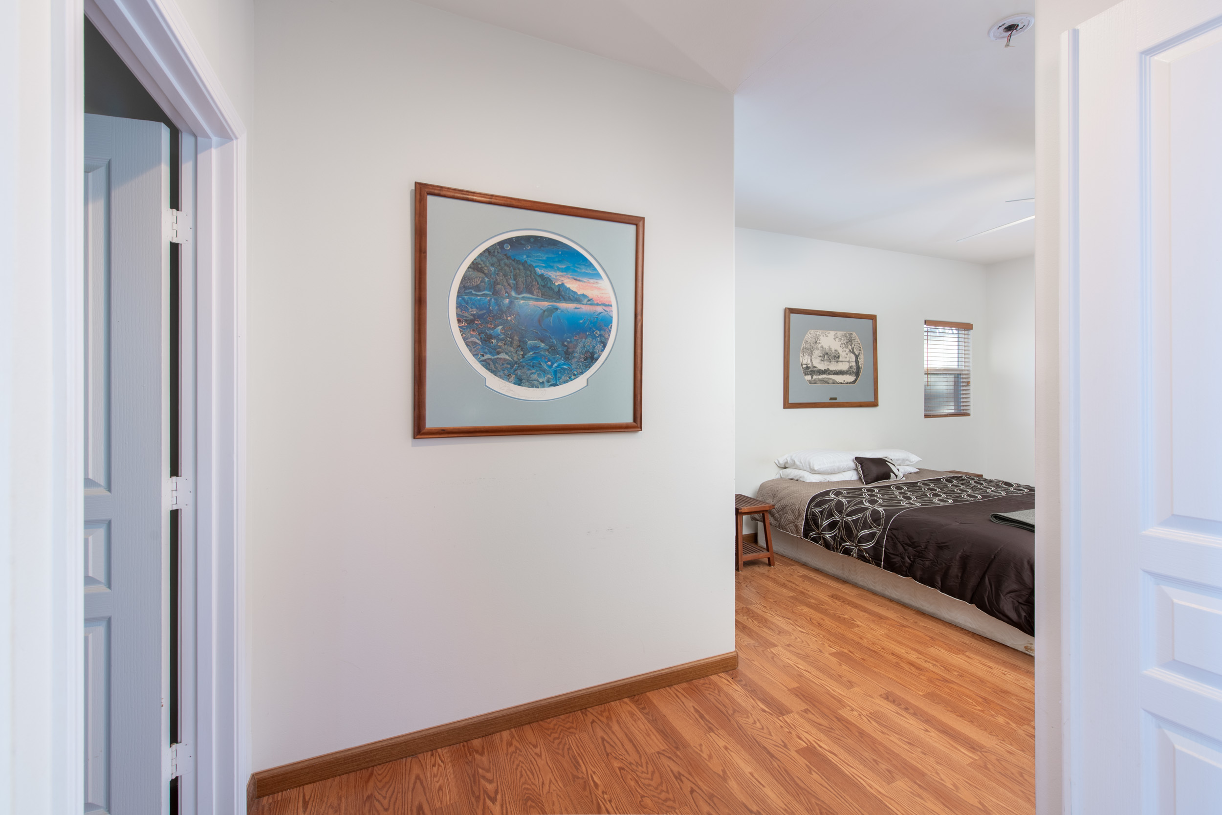 68-1693 Malie Street Waikoloa, HI 96738 - Photo 11 of 25 a room with a bed and painting on the wall