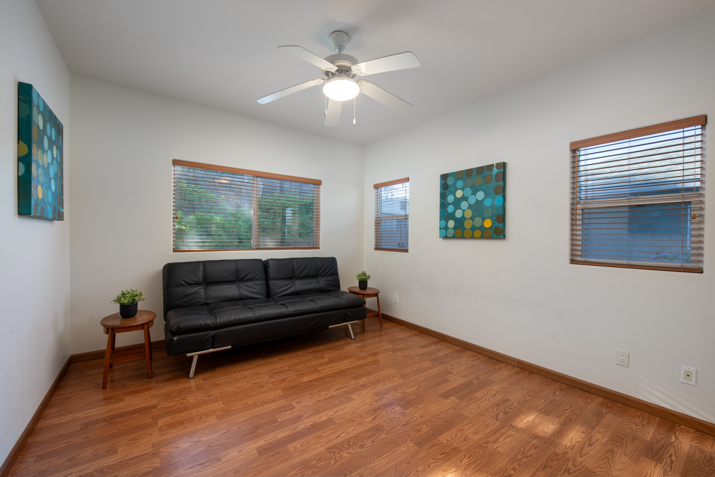 68-1693 Malie Street Waikoloa, HI 96738 - Photo 16 of 25 a living room with a bed furniture and a window