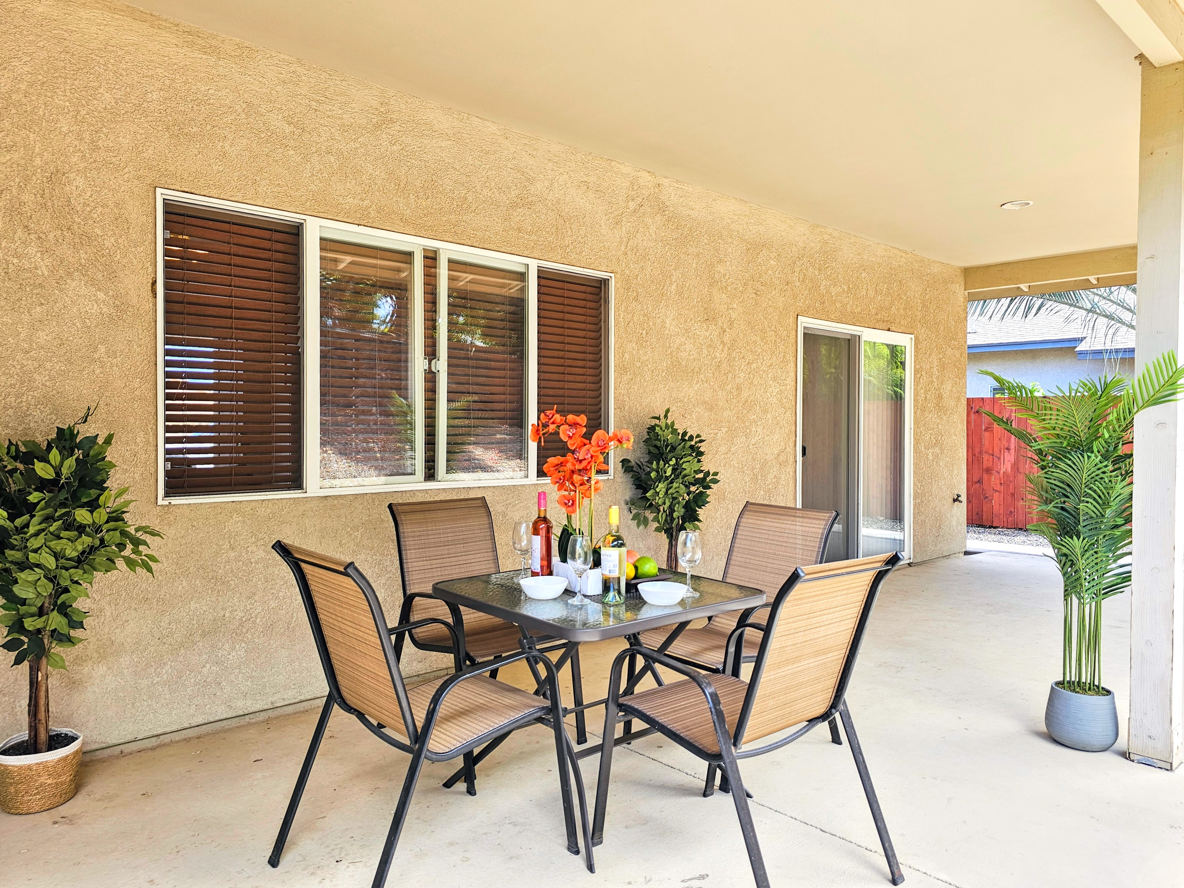 68-1693 Malie Street Waikoloa, HI 96738 - Photo 18 of 25 a view of a dining room with furniture and potted plants
