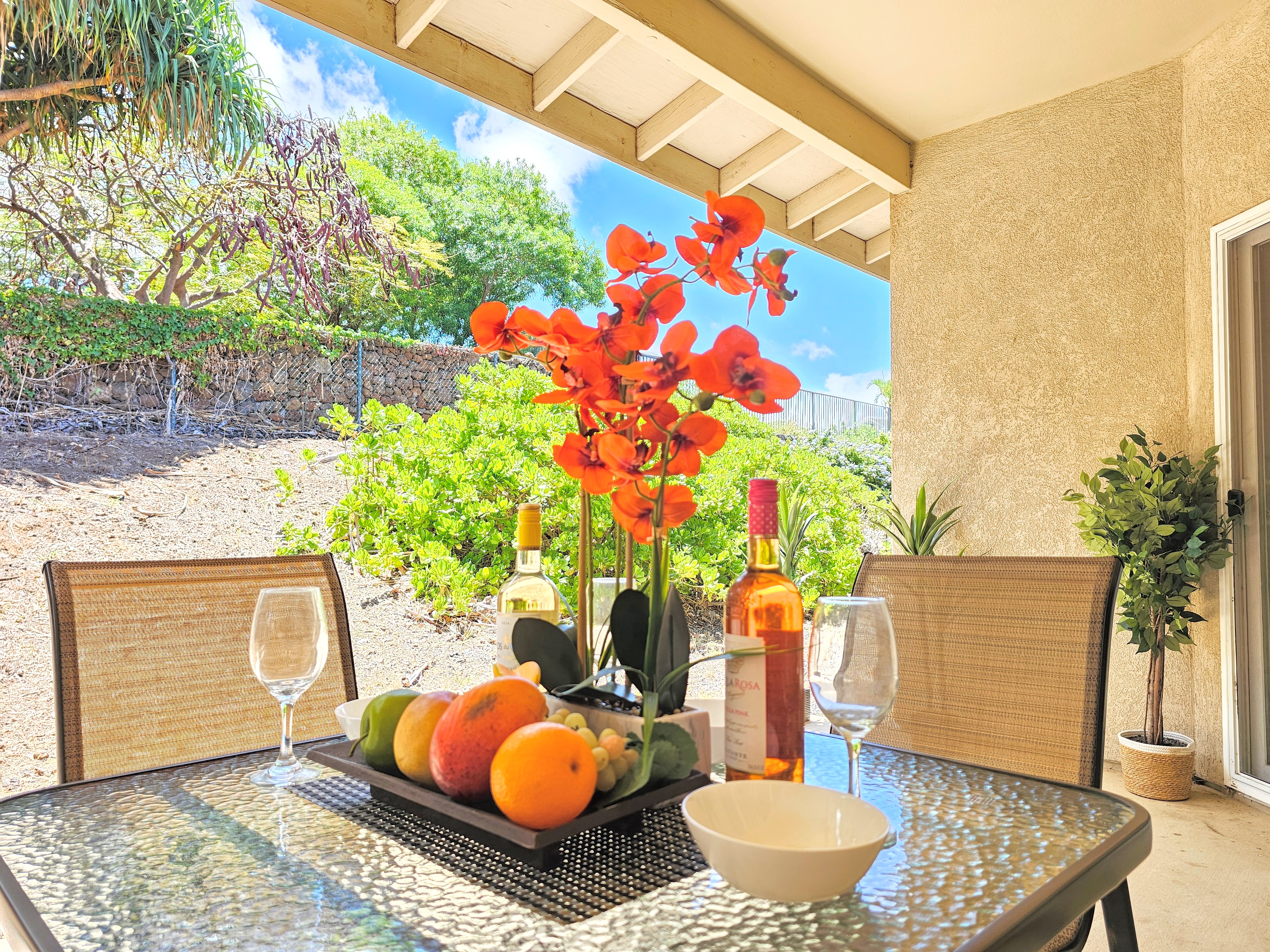 68-1693 Malie Street Waikoloa, HI 96738 - Photo 20 of 25 a backyard of a house with outdoor seating