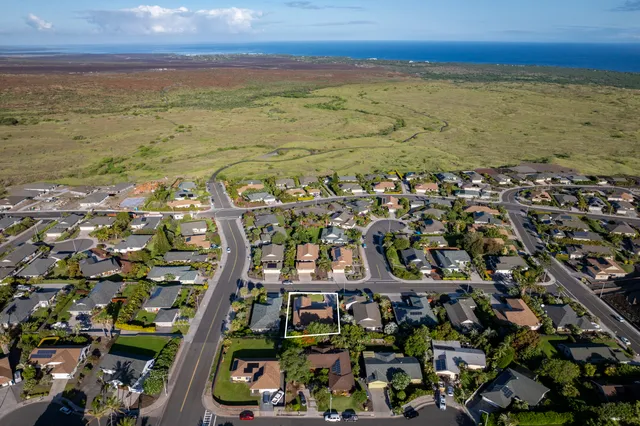 an aerial view of a house with a garden