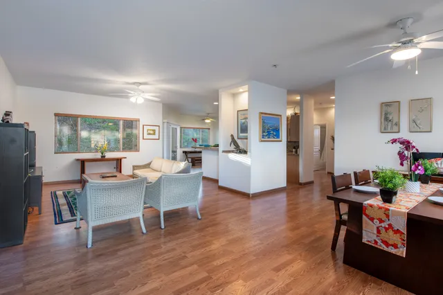 a view of a dining room with furniture and wooden floor