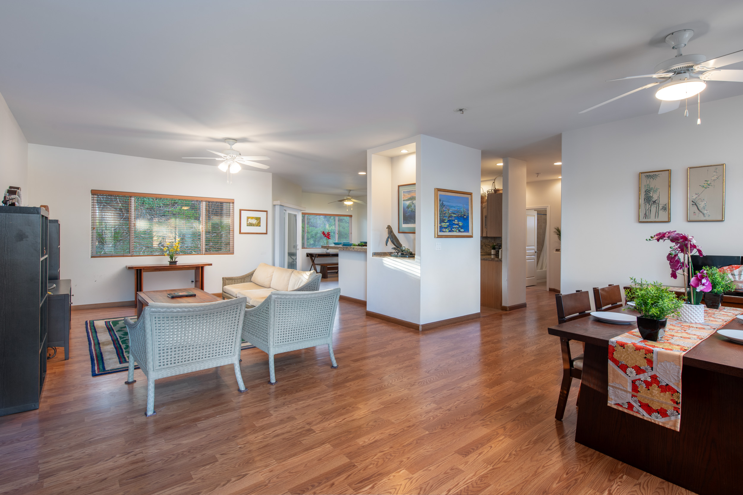 68-1693 Malie Street Waikoloa, HI 96738 - Photo 5 of 25 a living room with fireplace furniture and a wooden floor